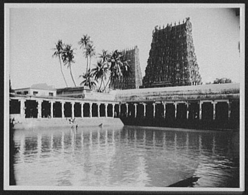 Gelatin silver photograph from 1895 showing the temple tank and the south tower of the Meenakshi Temple in Madurai.