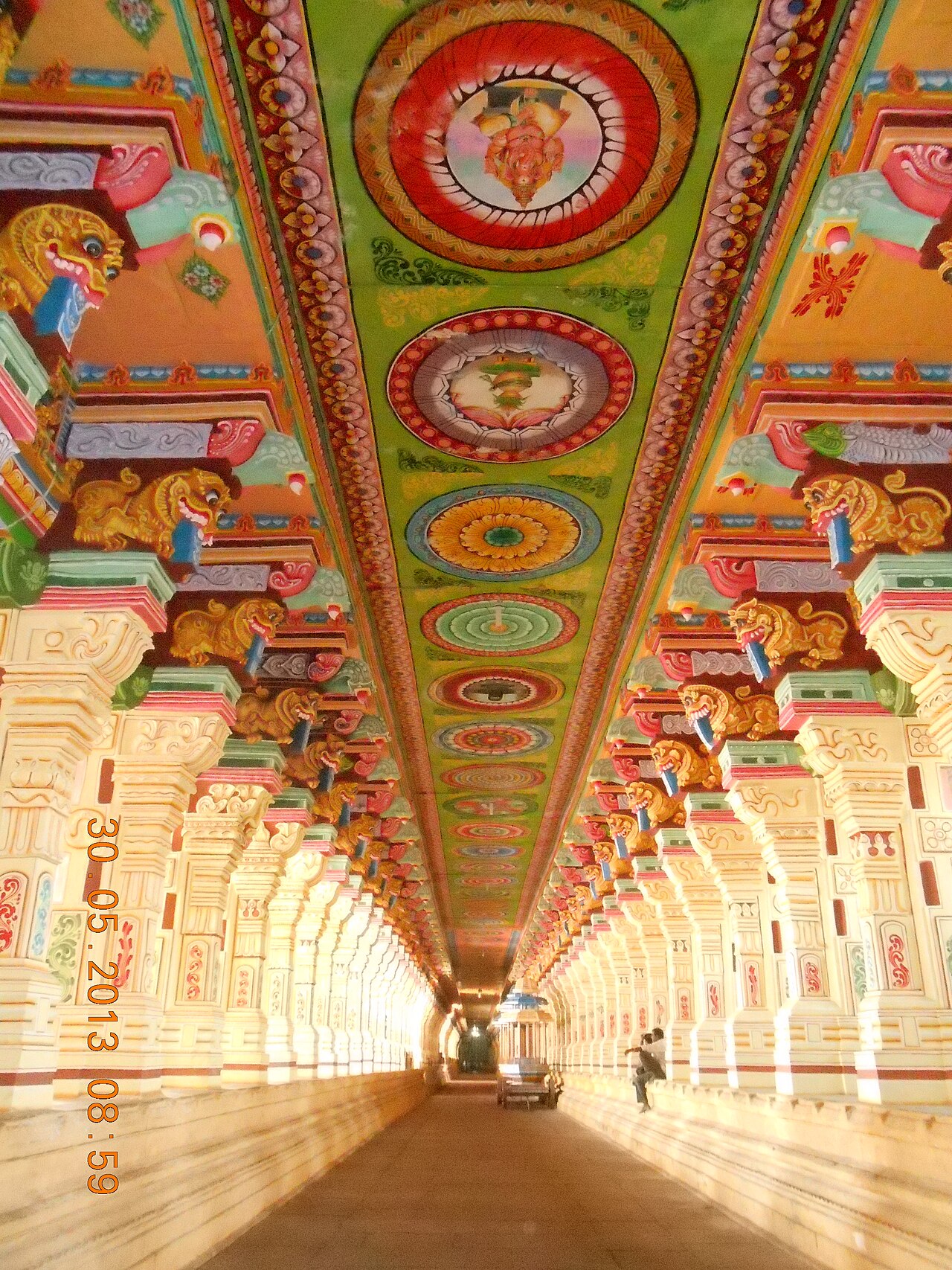 Color photograph of a long pillared corridor at the Ramanathaswamy Temple, Rameswaram.